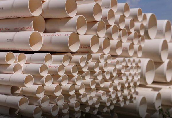 Stacks of PVC irrigation pipes for agricultural water systems — Pierson Supply irrigation materials and piping solutions