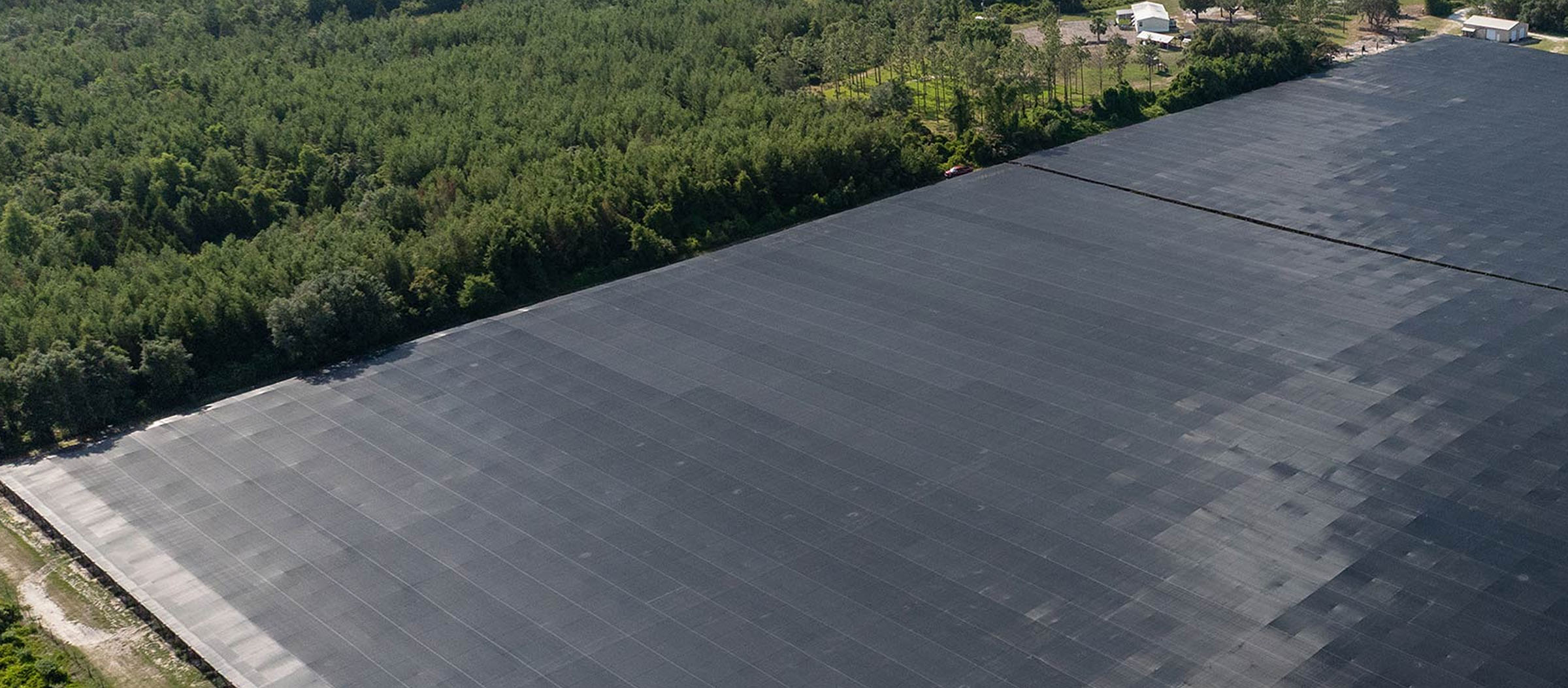 Aerial view of large protective shade structure covering crops — Pierson Supply materials for agricultural structures and grower protection